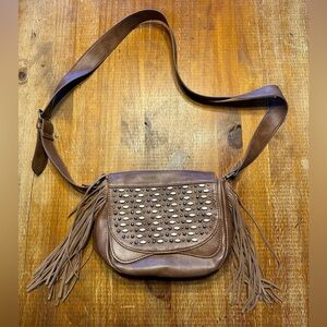 Small studded with fringe cross body.